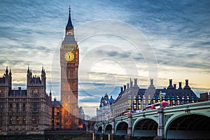 London, England - The famous Big Ben and Houses of Parliament with iconic red double decker buses