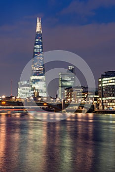 London, England - June 17 2016: Night Panorama of Southwark Bridge, The Shard skyscraper and Thames River, London