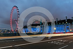 LONDON, ENGLAND - JUNE 16 2016: Night photo of The London Eye and County Hall from Westminster bridge, London, Great Brit