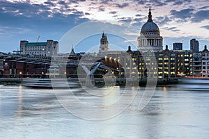 LONDON, ENGLAND - JUNE 17 2016: Night photo of Thames River, Millennium Bridge and St. Paul Cathedral, London