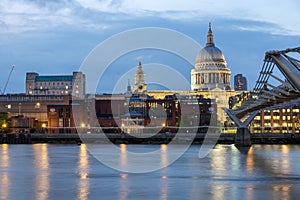 LONDON, ENGLAND - JUNE 17 2016: Night photo of Thames River, Millennium Bridge and St. Paul Cathedral, London