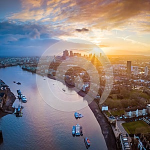 London, England - Panoramic aerial skyline view of east London at sunrise with skycrapers of Canary Wharf
