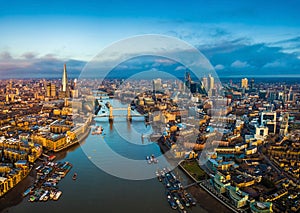 London, England - Panoramic aerial skyline view of London including Tower Bridge with red double-decker bus photo