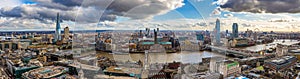 London, England - Panoramic skyline view of London with Millennium Bridge, famous skyscrapers and other landmarks photo