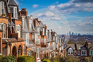 London, England - Typical brick houses and flats and panoramic view of london on a nice summer morning