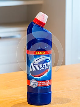 A blue bottle of famous Domestos bleach. Household disinfectant.