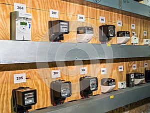 An electricity meter room. Various types of meters for taking readings.