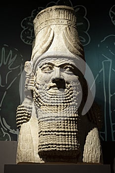 London, United Kingdom - Ancient Assyria statue of king Ashurbanipal from his royal palace in Nineveh at the archeologic