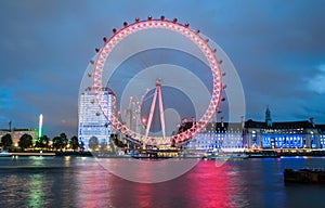 LONDON, ENGLAND. View of City Of London at sunset with London Eye