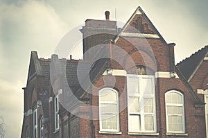 London Europe. Primary school top floor and roof on blue sky background.