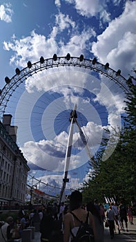 London eye cloudy blue sky