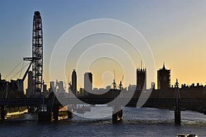 London Eye and Houses of Parliament silhouette at dusk