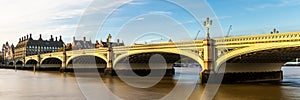 The London Eye on the South Bank of the River Thames at night in London, England. Web banner in panoramic view