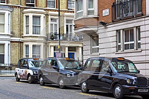 London, Great Britain. April 12, 2019. Kensington street. Cab parking. London cab is considered the best taxi in the