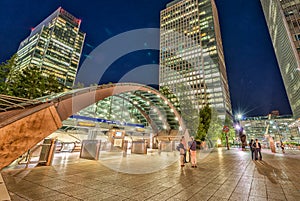 LONDON - JUNE 14, 2015: Lights of Canary Wharf buildings at night. Canary Wharf is the city financial district