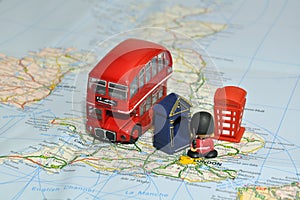 London on map of England with miniature souvenirs photo