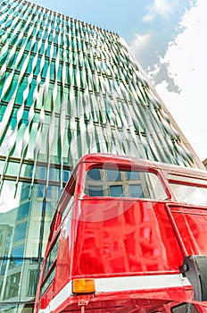 London red bus against modern skyline