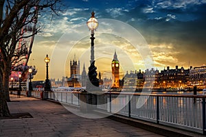 The London riverside of the Thames with view to the Big Ben during sunset