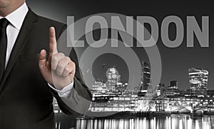 London skyline at night with businessman concept