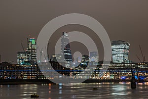 London skyline at night with reflections