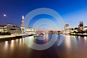 London skyline panorama at night, England the UK. River Thames, the Shard, City Hall.