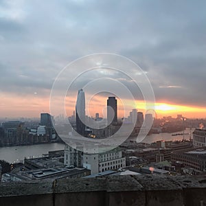 London skyline at sunset showing London Eye