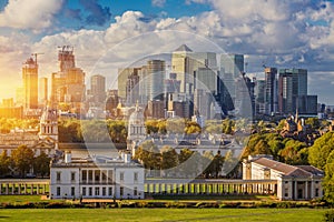 London at Sunset Light, England,  Skyline View Of Greenwich College and Canary Wharf At Golden Hour Sunset With Blue Sky And