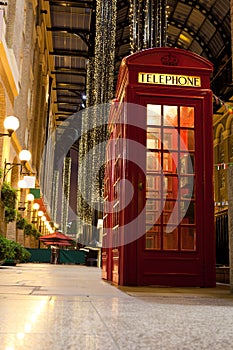 London symbol red phone box in illuminated street