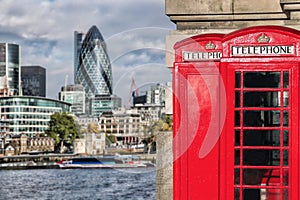 London symbols with red PHONE BOOTHS against modern architecture in England