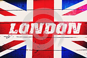 London text on old designed grunge british flag