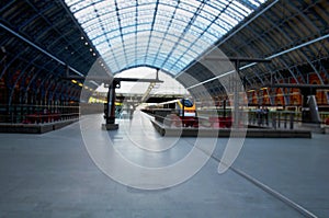 A London train station with train on platform