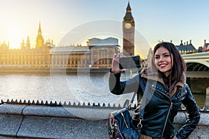 London traveler woman takes selfie pictures at Westminster, UK