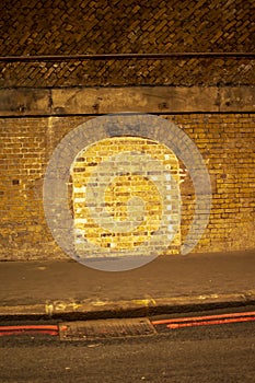 London tunnel with yellow lights and sealed door