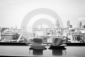 London and two cups of coffee, bw