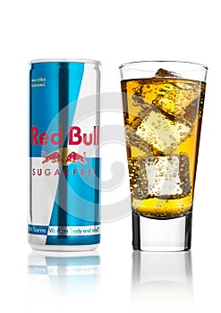 LONDON, UK - APRIL 12, 2017: Can of Red Bull Energy Drink Sugar Free with glass and ice cubes on white background. Red Bull is the