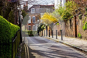 LONDON, UK - April, 13: Typical english street in spring with victorian houses in London