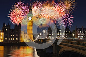 London, UK - Big Ben and Westminster Palace with fireworks during New Year`s celebration photo