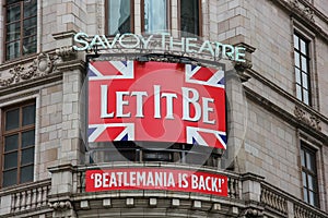 Beatlemania is back. Let It Be musical billboard, Savoy Theatre. Signboard over Savoy Theatre entrance with poster of one famous a