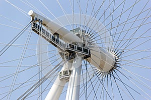 London, UK - 27 July, 2018: Close view London eye axis on blue sky background