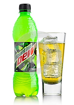 LONDON, UK - JUNE 9, 2017: Bottle and glass of Mountain Dew drink on ice isolated on white. Mountain Dew citrus-flavored soft