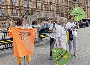 London / UK - June 26th 2019 - Activists holding signs about climate change and fossil fuels