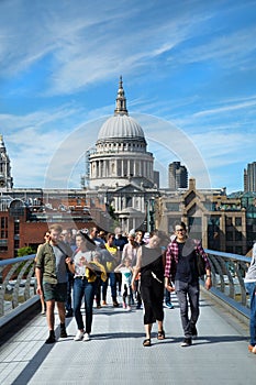 Tourists walking on millennium bridge in London