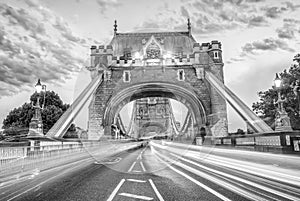 LONDON, UK - JUNE 30TH, 2015: Tower Bridge with city traffic at night