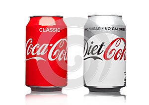 LONDON,UK - MARCH 21, 2017 : Cans of Coca Cola classic and Diet drink on white. The drink is produced and manufactured by The Co