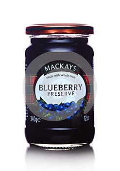 LONDON, UK - MARCH 10, 2018 : Glass jar of Mackays Blueberry Preserve on white.