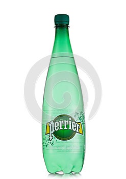 LONDON,UK - MAY 14, 2022: Perrier mineral carbonated water in large plastic bottle on white background. roduct of France