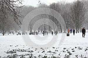 London, uk, 2nd march 2018 - Green Park covered in snow as comuters walk to work beast from the east meets storm sally