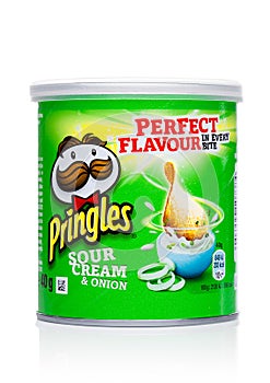 LONDON, UK - November 17, 2017: Pringles potato chips sour cream in mini tube on white. Potato and wheat-based stackable snack chi