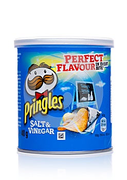 LONDON, UK - November 17, 2017: Pringles potato chips vinegar in mini tube on white. Potato and wheat-based stackable snack chips