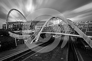 London, UK - October 6, 2016: The wembley stadium and wembley train station in black and white